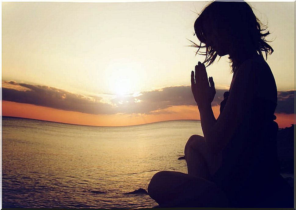 Woman meditating silently