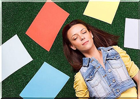 Woman lying down smiling for a positive thought