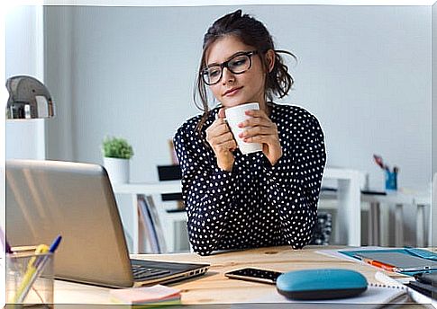 Woman with glasses working with computer