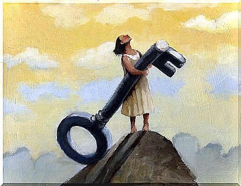 Woman with a key on a mountain