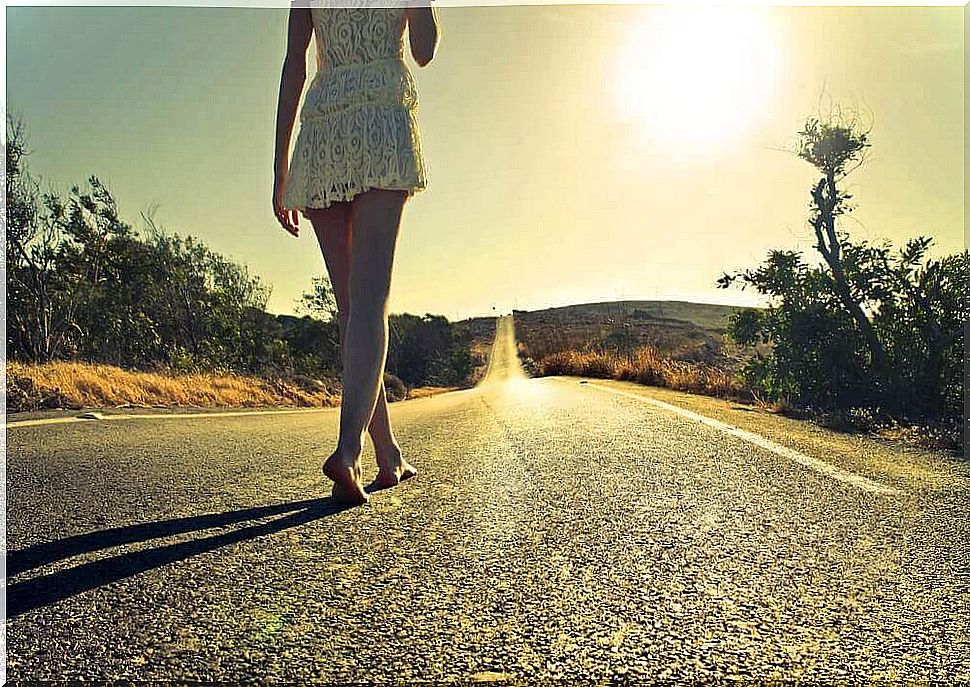Woman walking barefoot thinking about the importance of unlearning