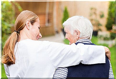 Caring woman with older adult