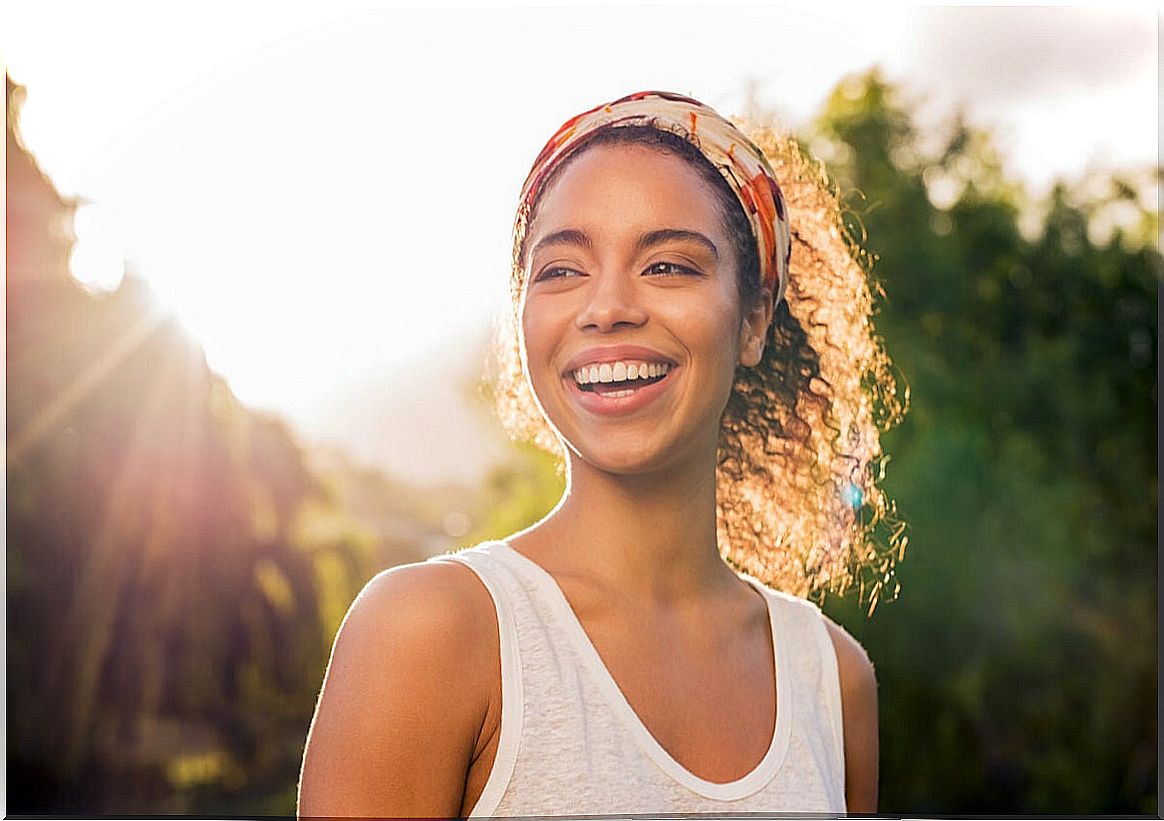 Woman smiling at sunset