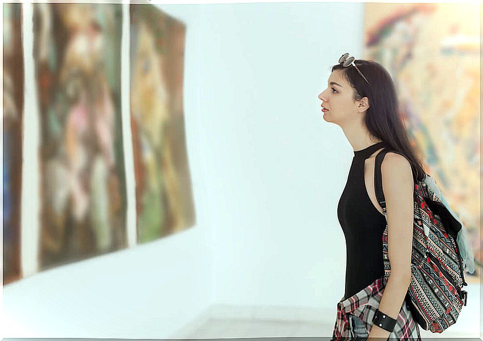 woman admiring artwork