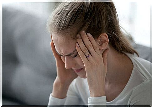 Woman with strong migraine pain