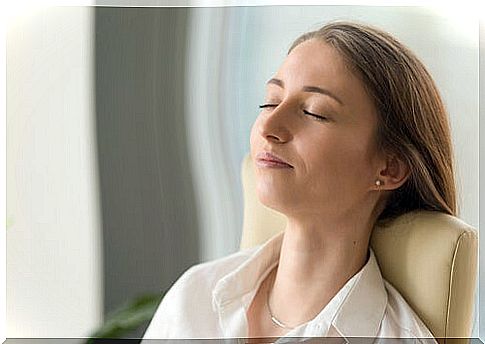 Woman with eyes closed meditating