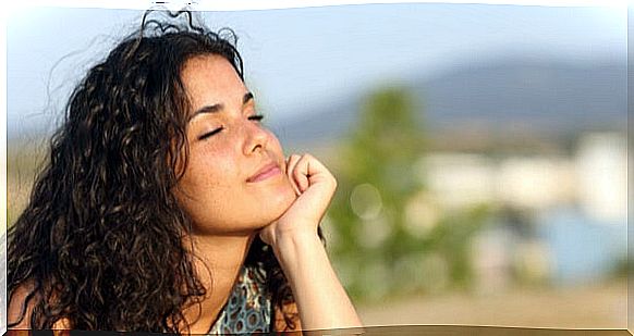 Woman thinking with eyes closed