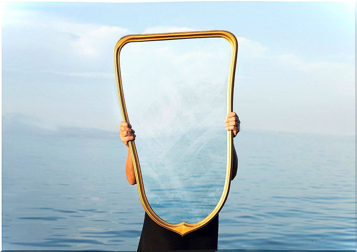 Person holding mirror