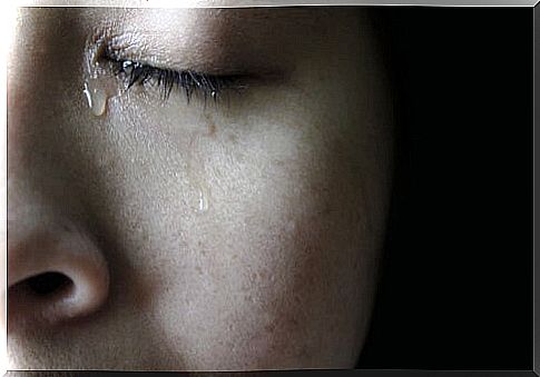 Woman with tear on her face