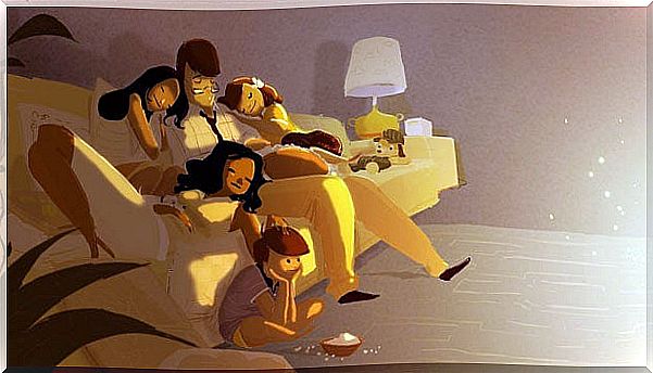 Parents asleep with their children on the couch