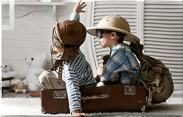 children playing in a suitcase