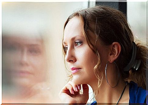 Woman looking out the window thinking about her education