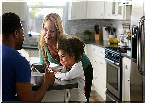 Couple in the kitchen with their daughter