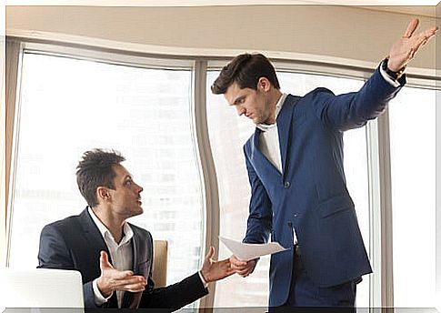 Men facing a work conflict